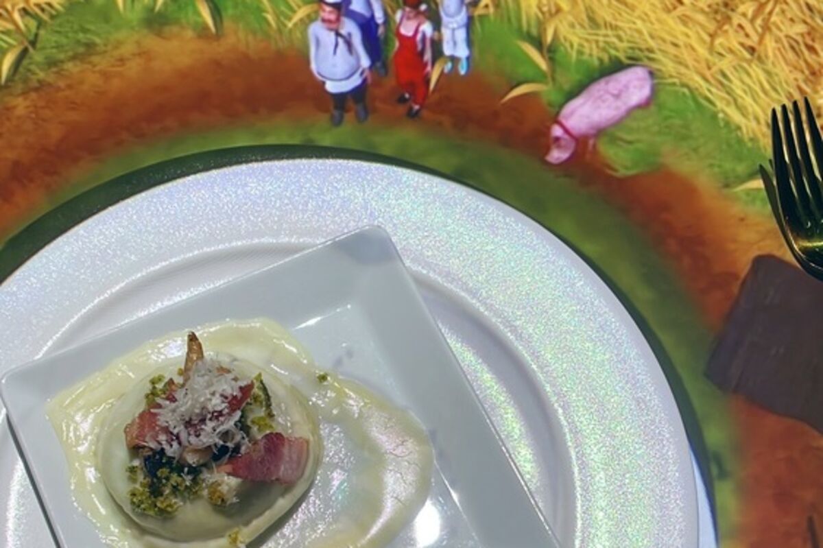 A ravioli and 3D animation of a little chef and an pig in a wheat field.