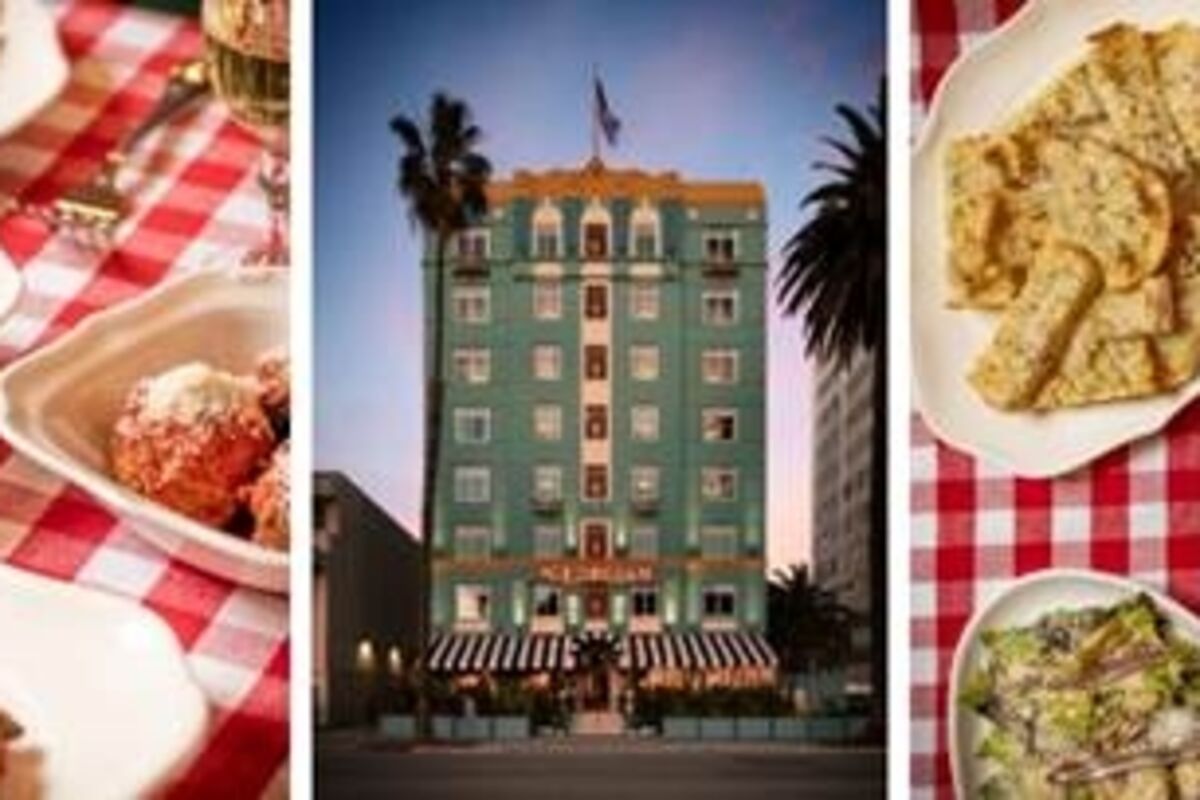 Spaghetti Sunday menu with salad, pasta, and a view of the hotel.